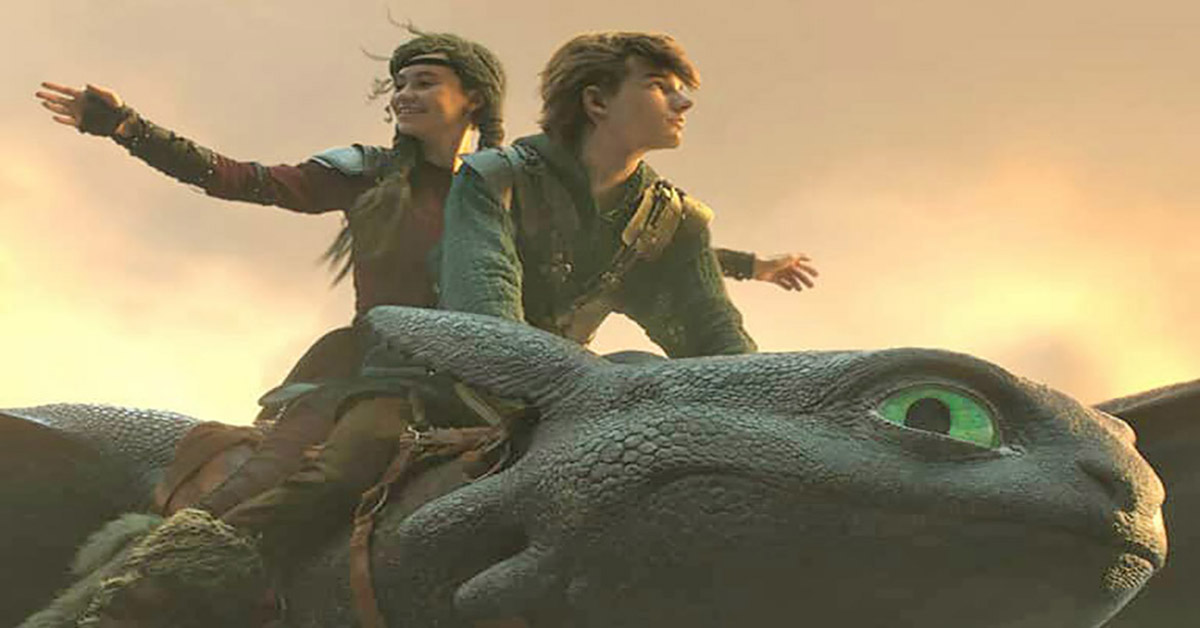Two kids riding on top of a flying dragon