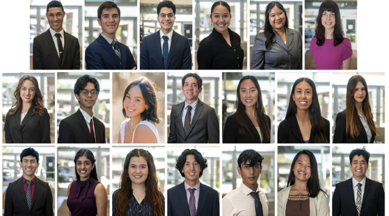 A group of smiling teens are dressed in professional clothes, standing in rows for a formal photo. They look proud and ready to do something important.