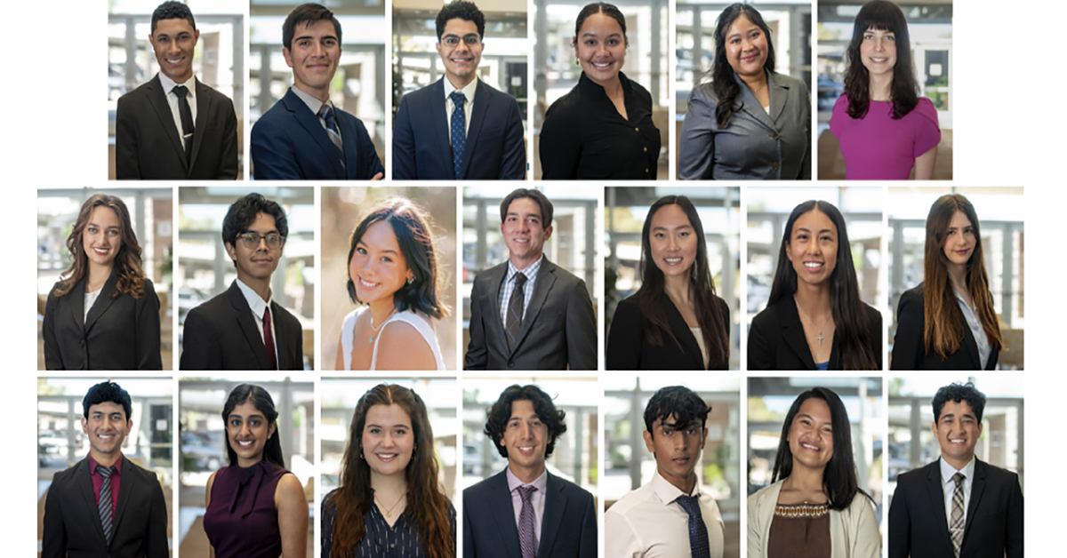 A group of smiling teens are dressed in professional clothes, standing in rows for a formal photo. They look proud and ready to do something important.