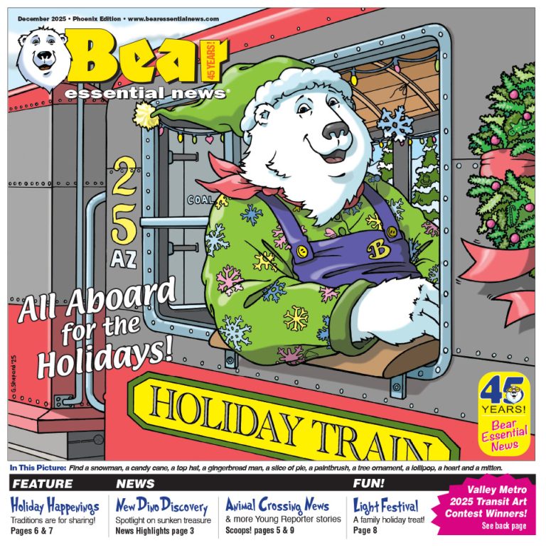 Front cover of December 2025 Phoenix Edition: Boomer the polar bear wears a green elf hat and colorful snowflake shirt as he smiles on a decorated holiday train with trees and lights.