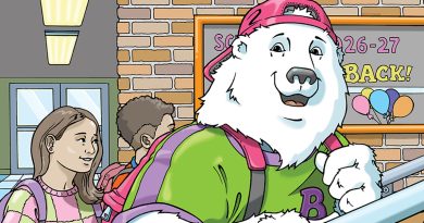 A cartoon of Boomer the polar bear wearing a pink baseball cap, green shirt, and purple backpack, walking down a school stairway next to a smiling girl in a checkered shirt. Behind them is a brick wall with a bulletin board that says 'Welcome Back!' and shows the school year 2026-27 with colorful balloons."
