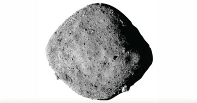 Black and white photo of a large, rough and rocky asteroid floating in space against a white background.